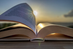 Book open in the sunlight reflecting on pages