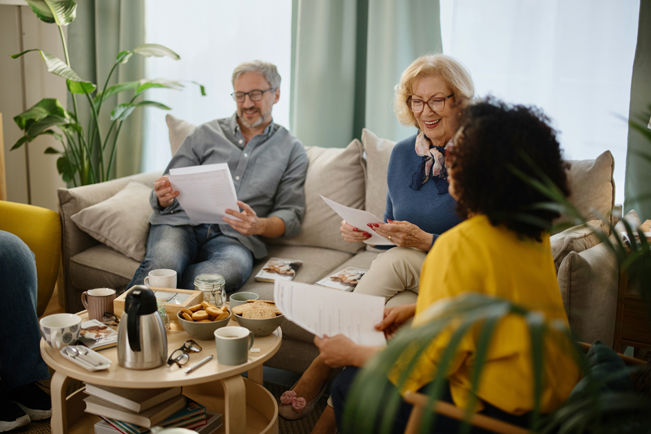 Diverse group of friends discussing a book at a book club meeting