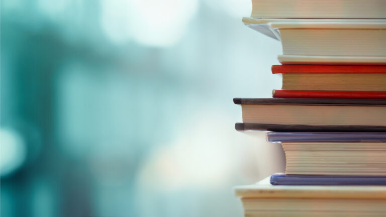Books stacked on top of one another