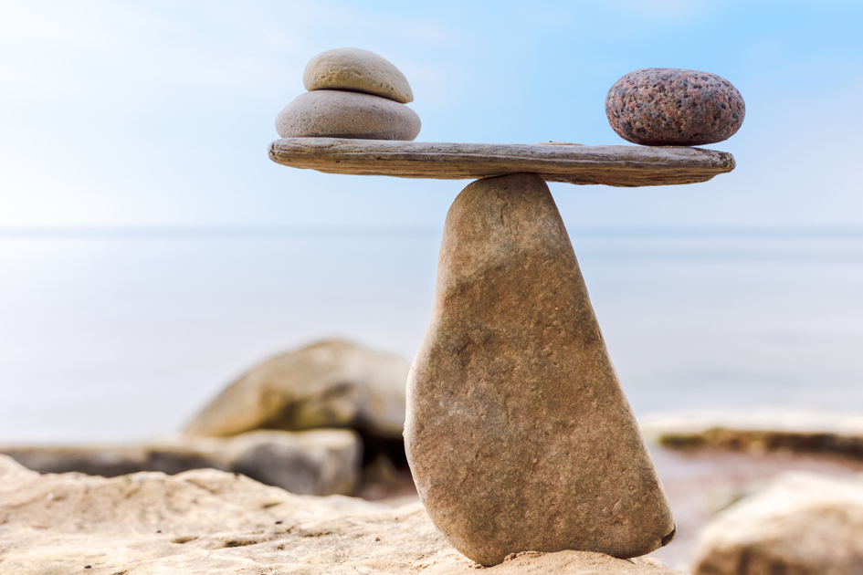 A stack of stones balanced on a beach