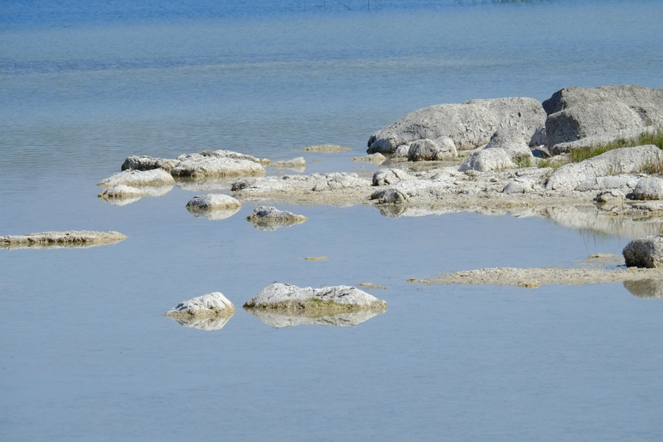 Blue Calm Water and Rocks
