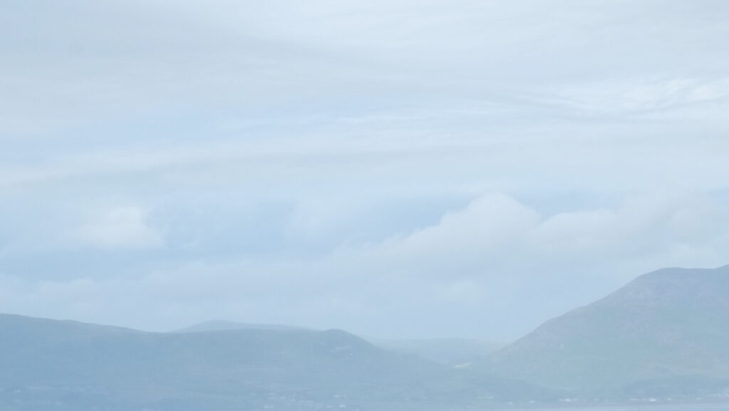 mountains and sky in blue heat mist
